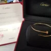 Cartier-Au750-Rose-Gold-Nail-Bangle-Small-Bracelet.webp Bracelet jonc clou Cartier en or rose 750, petit modèle, 9,1 g