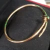 Cartier-Au750-Rose-Gold-Nail-Bangle-Small-Bracelet-3.webp Bracelet jonc clou Cartier en or rose 750, petit modèle, 9,1 g