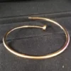 Cartier-Au750-Rose-Gold-Nail-Bangle-Small-Bracelet-4.webp Bracelet jonc clou Cartier en or rose 750, petit modèle, 9,1 g