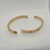 Bracelet Cartier Love en or jaune 18 carats, taille 18, fermoir à vis, neuf, avec boîte et papier