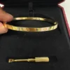 Cartier-Love-Bangle-Bracelet-18k-Yellow-Gold-11.webp Bracelet jonc Love de Cartier | Or jaune 18 carats | Certificat et écrin | Taille 19
