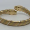 Bracelet Cartier Panthère Cougar Trinity en or jaune, blanc et rose 18 carats, service 2025