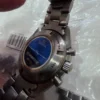 Chronographe automatique Omega Speedmaster HB-SIA GMT d'occasion. Bon état.