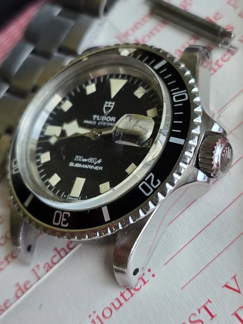 Tudor-Rolex-Submariner-9411-Vintage-Snowflake-Diver-Full-39.webp Tudor Rolex Submariner 9411 Vintage Snowflake Diver, coffret complet, papiers, 1976